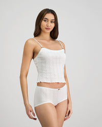 Model wears Body Cocoon Camisole in WHITE. On body side view