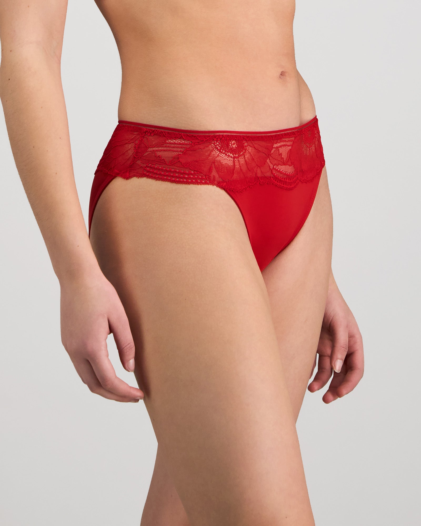 Model wears Lumiere Bikini in SALSA. On body side view