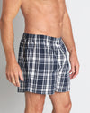 Model wears Lounge Boxer in BLUE WING TEAL CHECK. On body side view