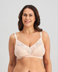 Model wears Bendon Nurture Maternity Bra in LATTE. On body front view