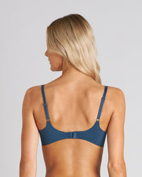 Model wears Weightless Form Contour Bra in BLUE WING TEAL. On body back view