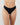 Model wears Au Naturel Thong in BLACK. On body front view