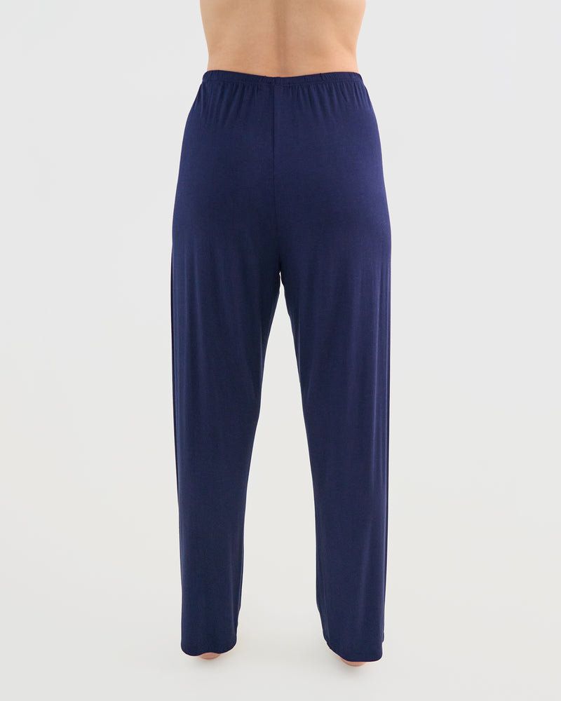 Model wears Bamboo Bliss Long PJ Pant in NAVY BLAZER. On body back view