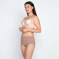 Model wears Medium Control Full Brief in MOCHA. On body front view