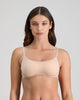 Model wears Extra-Ordinary Contour Bra in LATTE. On body front view