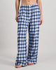 Model wears Cosy Flannel Long PJ Pant in BLUE CHECK. On body front view