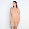 Model wears Medium Control Jumpsuit in CARAMEL. On body side view