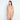 Model wears Medium Control Jumpsuit in CARAMEL. On body side view
