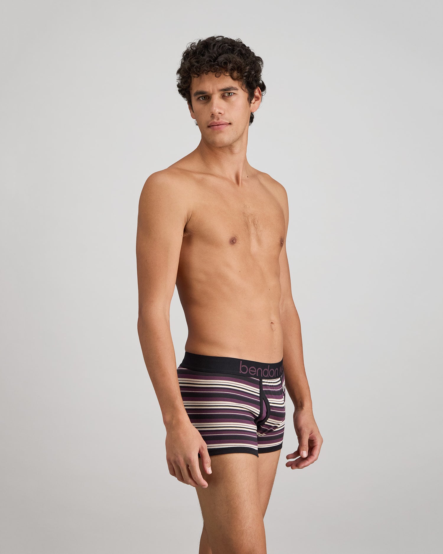 Bold Stripe Mens Trunk in BLACK/PLUM STRIPE. Flat lay back view