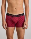 Model wears Retros Print Mens Trunk in DISRUPTED SPOT PRINT. On body front view