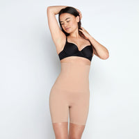 Model wears Medium Control High Waisted Shaper Short in CARAMEL. On body front view