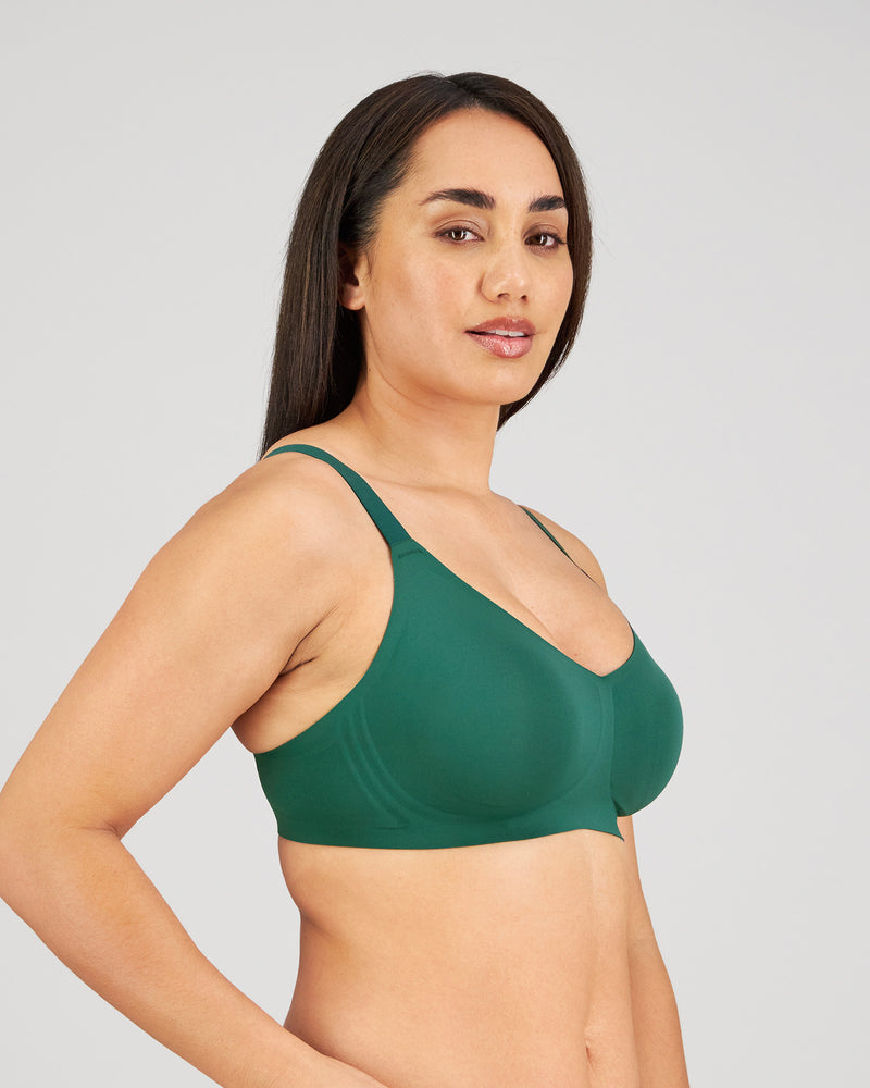 Model wears Comfit Collection Wire Free Bra in RAIN FOREST. On body side view