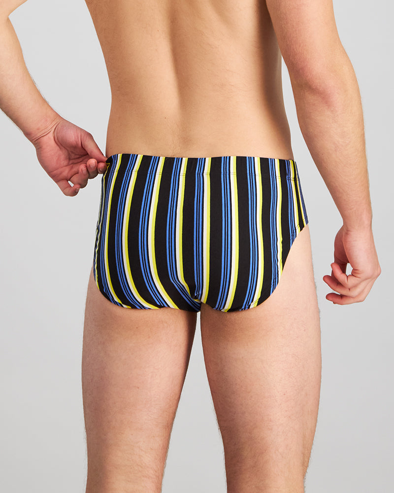 Model wears Cotton Stretch Mens Brief in YELLOW/REGATTA STRIPE. On body back view