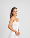 Model wears Simply Seamless Camisole in WHITE. On body side view