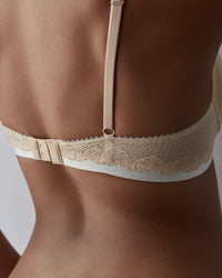Model wears Geometric Lace Contour Bra in TOASTED ALMOND/PRISTINE. On body back view