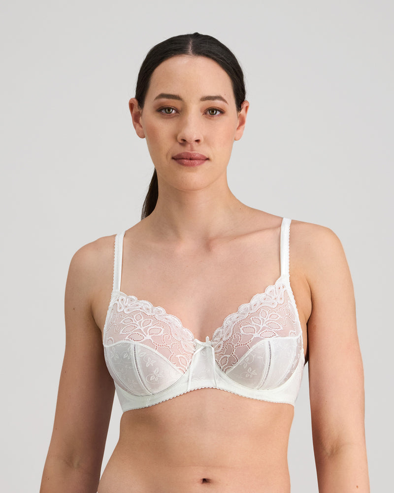 Model wears Yvette Underwire Bra in WHITE. On body front view