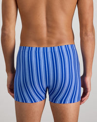 Model wears Cotton Stretch Mens Trunk in SURF THE WEB STRIPE. On body back view