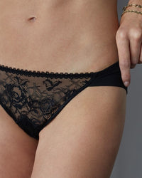 Model wears Naturally Me Bikini in BLACK. On body front view