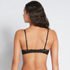 Model wears Alessandra Push Up Bra in BLACK. On body back view