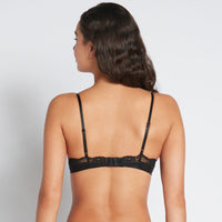 Model wears Alessandra Push Up Bra in BLACK. On body back view