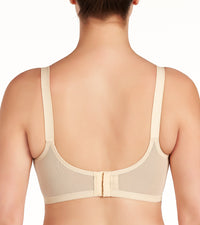 Model wears Rigid Soft Cup Wire Free Bra in HONEY BEIGE. On body back view