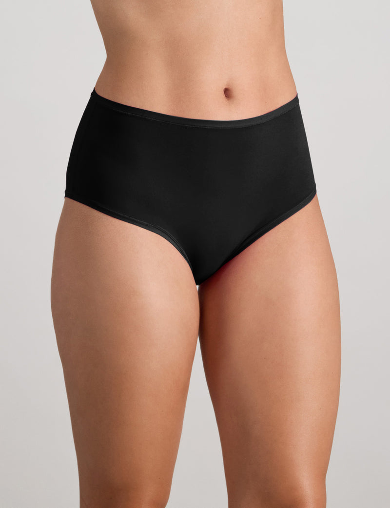 Model wears Extra-Ordinary Full Brief in BLACK. On body side view