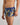 Model wears Retros Print Mens Trunk in WILD CAMO PRINT. On body side view