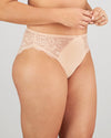 Model wears Laurel High Cut Brief in LATTE. On body side view