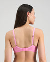Model wears Lightweight Underwire Bra in BUBBLEGUM PINK. On body back view