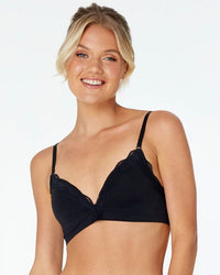 Model wears Nikki Wire Free Bra in BLACK. On body front view