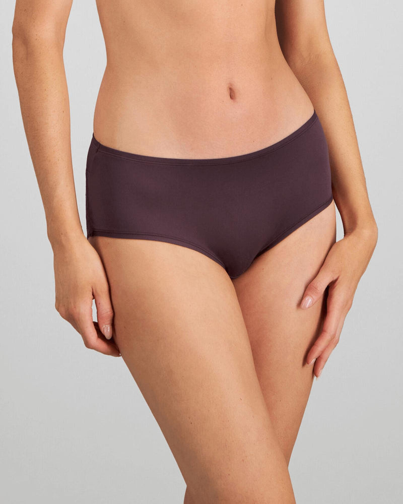 Model wears Hazel Midi in PLUM PERFECT. On body front view