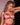 Model wears Niara Push Up Bra in JESTER RED. On body side view