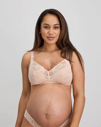 Model wears Bendon Nurture Maternity Bra in LATTE. On body front view