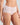 Model wears Au Naturel Full Brief in FESTIVAL BLOOM. On body side view