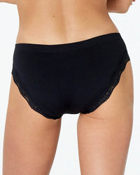 Model wears Nikki Bikini in BLACK. On body back view