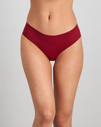 Model wears No Show Bikini in BIKING RED. On body front view