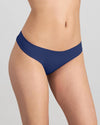 Model wears Seamless Soft Thong in Medieval Blue. On body side view