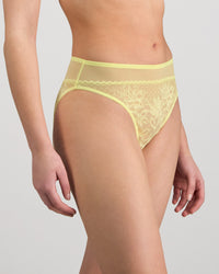 Model wears Elevate High Cut Brief in LEMON MERINGUE. On body side view