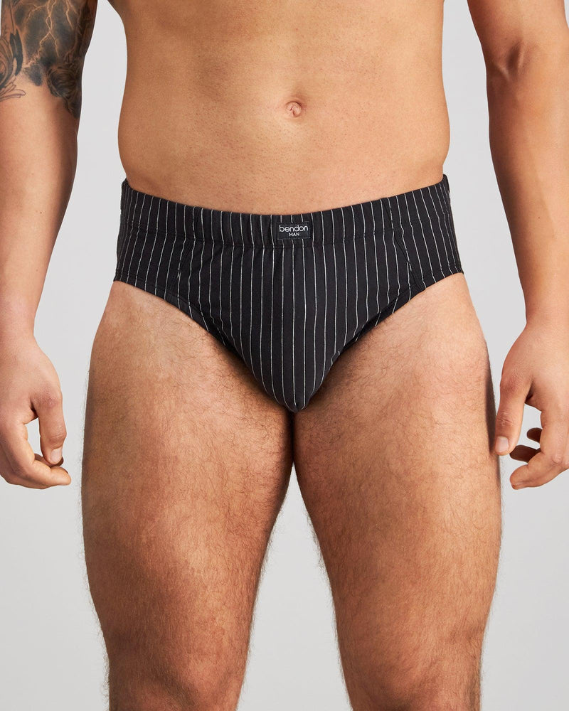 Model wears Cotton Stretch Mens Brief in BLACK PINSTRIPE. On body front view