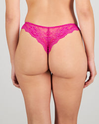 Model wears My Fit Lace Thong in FANTASY FUCHSIA. On body back view