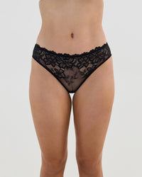 Model wears Lacey Bikini in BLACK. On body front view