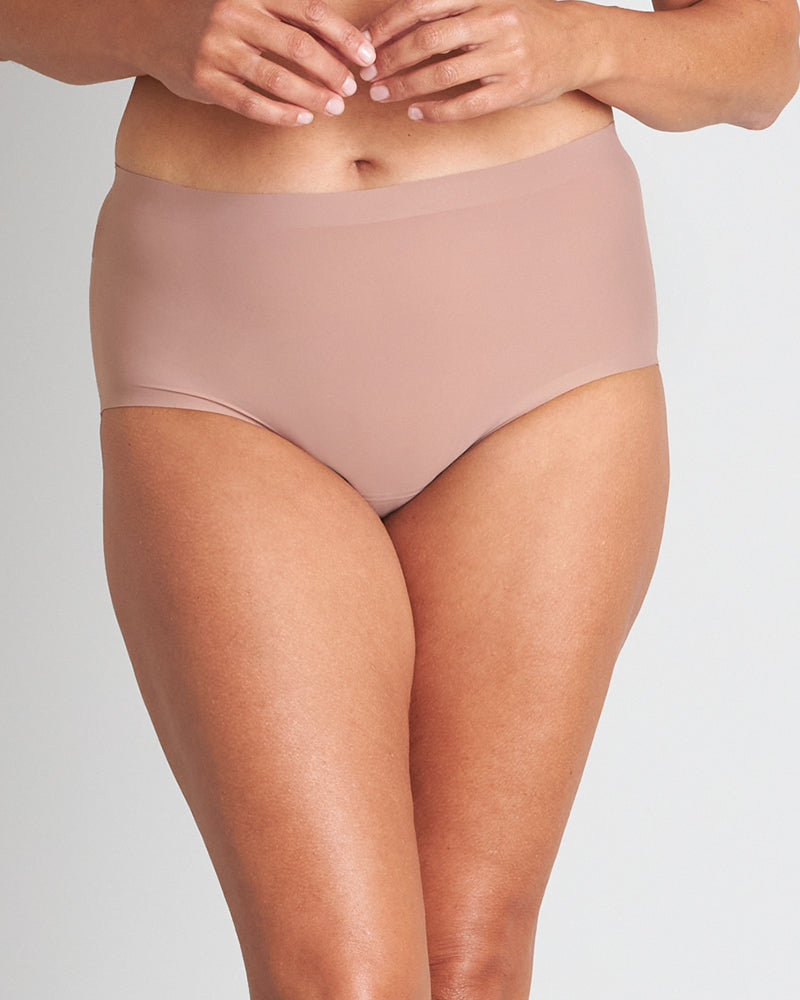 Model wears Flo Light Full Brief in MOCHA. On body front view