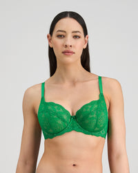 Model wears Juniper Underwire Bra in PARADISE GREEN. On body front view