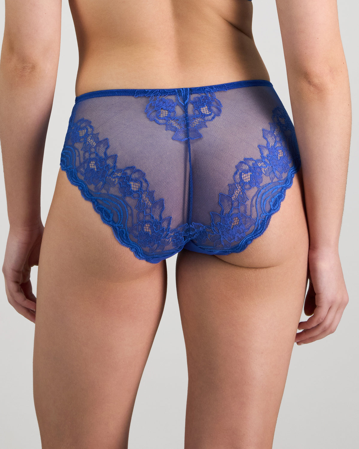 Model wears Intrigue Midi in DAZZLING BLUE. On body back view