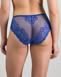 Model wears Intrigue Midi in DAZZLING BLUE. On body back view