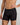 Model wears Bamboo Mens Trunk in BLACK. On body side view
