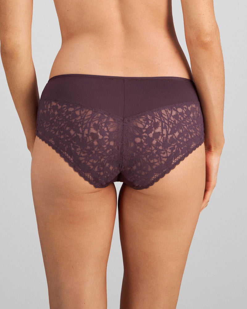 Model wears Hazel Midi in PLUM PERFECT. On body back view