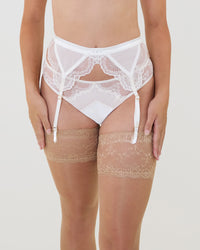 Model wears Una Elegance Suspender in SUGAR. On body front view