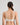 Model wears Yvette Underwire Bra in WHITE. On body back view