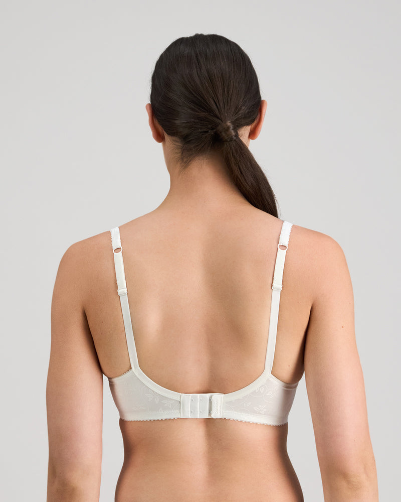 Model wears Yvette Underwire Bra in WHITE. On body back view